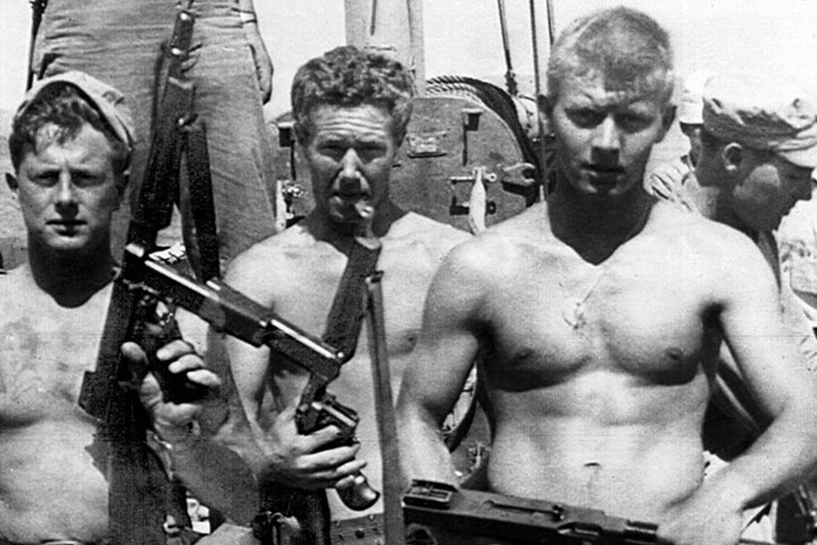 BM3 Warren “Fins” Foley is seen at the left in this photograph.