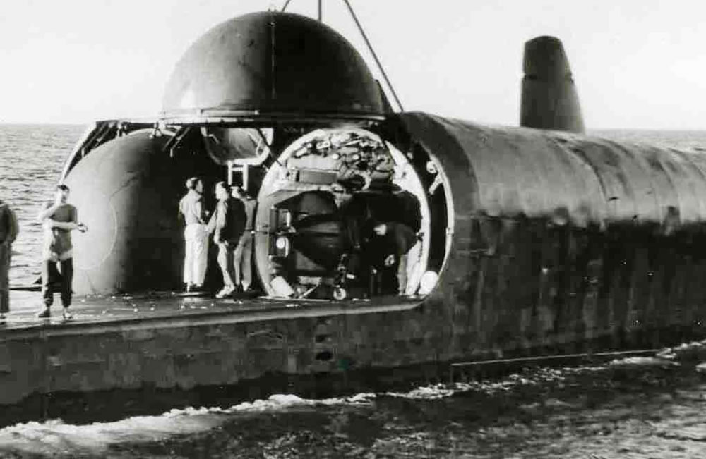 USS Grayback with starboard hangar door opened in its launching position housing a MK VII SDV