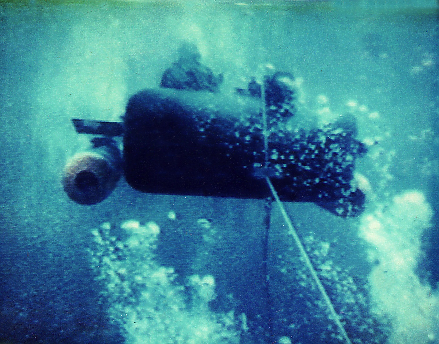 A MK IX SDV being launched from the deck of a submarine with the SWA
