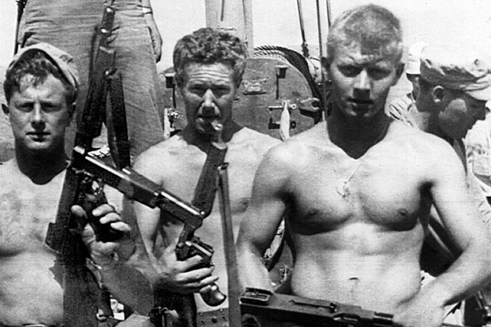BM3 Warren “Fins” Foley is seen at the left in this photograph.