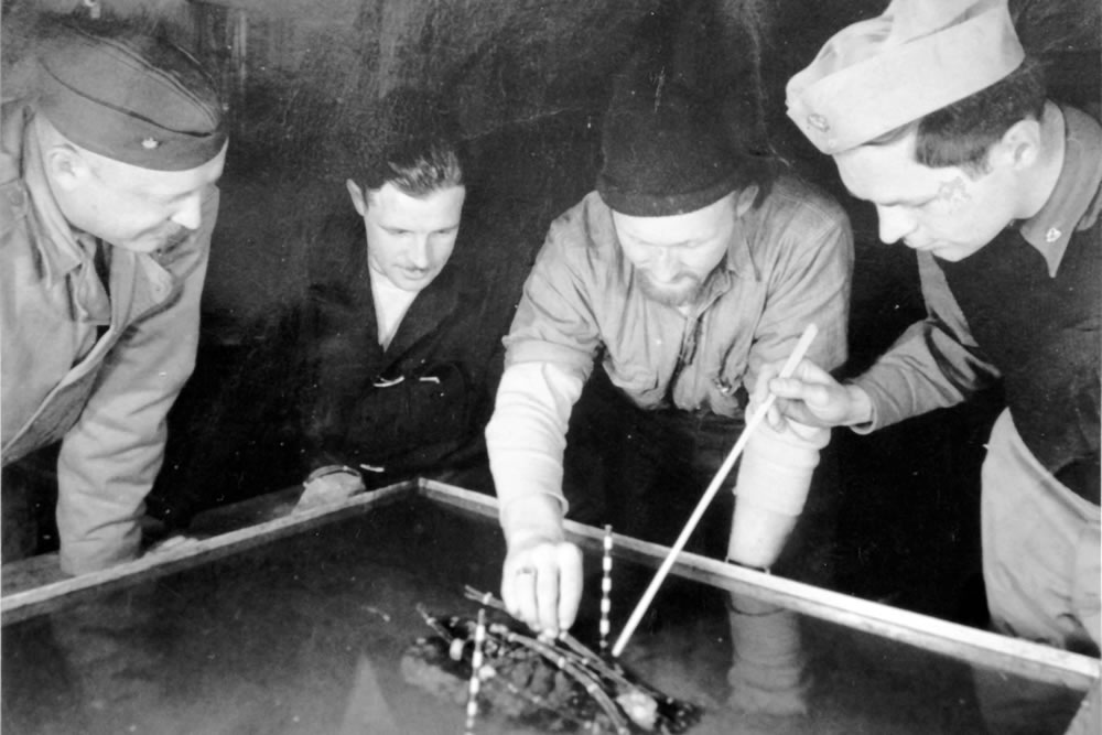 Kiska explosives planning (l-r): LCDR Chidester, Henry L. Green, Andres Oddstad, and Ensign Edwin S. Williams.